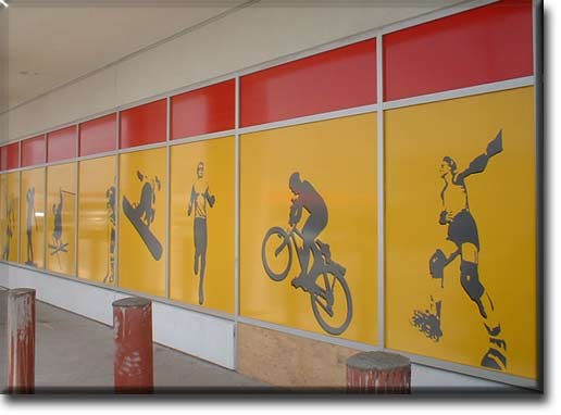 Red, yellow, black and grey vinyl applied to first surface at Sport Mart - Ajax, Ontario.